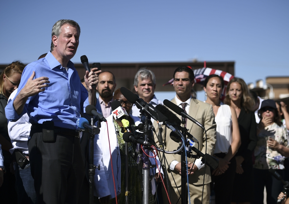 New York mayor Bill de Blasio speaks to a crowd of people at the Tornillo Port of Entry near El Paso, Texas, June 21, 2018 during a protest rally by several American mayors against the US administration's family separation policy.  AFP / Brendan Smialowsk