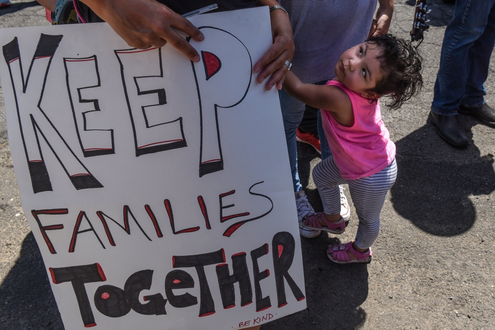 People participate in a protest against recent U.S. immigration policy of separating children from their families when they enter the United States as undocumented immigrants, in front of a Homeland Security facility in Elizabeth, NJ, U.S., June 17, 2018.