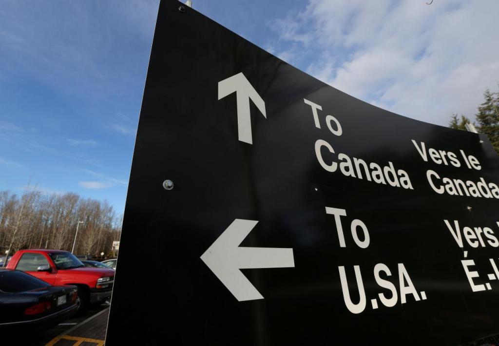 File photo of a sign giving directions to Canada and the United States border February 16, 2017, used for representation purposes only. REUTERS/Chris Helgren/File Photo