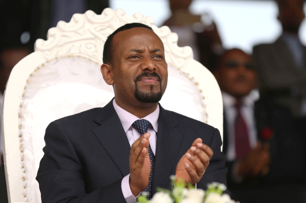 FILE PHOTO: Ethiopia's newly elected prime minister Abiy Ahmed attends a rally during his visit to Ambo in the Oromiya region, Ethiopia April 11, 2018. REUTERS/Tiksa Negeri/File Photo