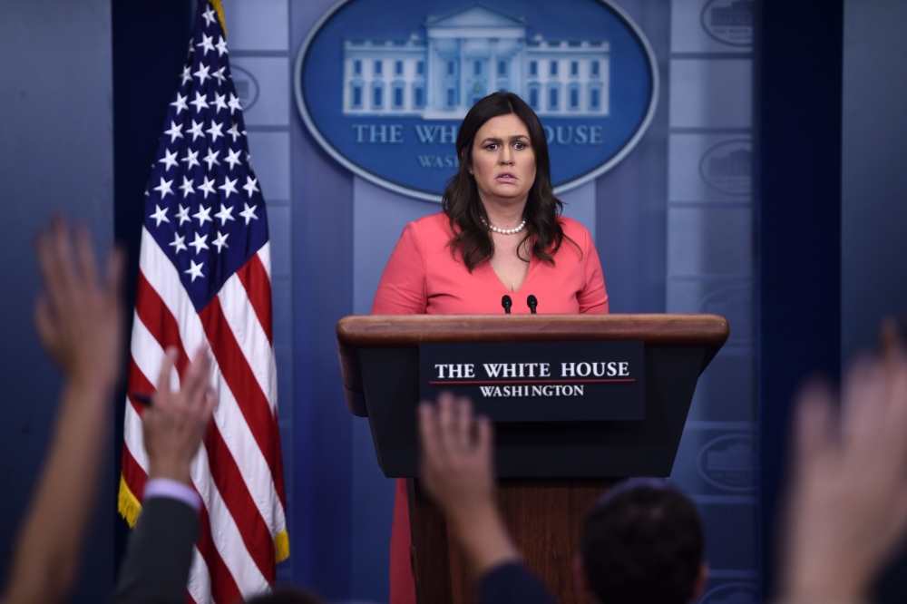 White House spokesperson Sarah Huckabee Sanders takes questions during a press briefing at the White House in Washington, DC on June 18, 2018. / AFP / Brendan SMIALOWSKI
