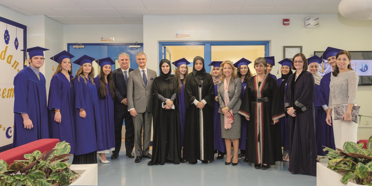 Students with officials during the graduation ceremony.