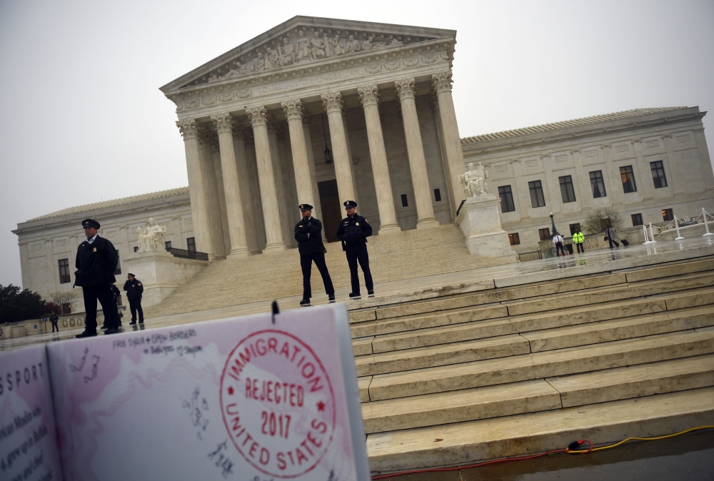 In this file photo taken on April 25, 2018 activists rally against the Muslim Ban in front of the court in Washington. (AFP / Andrew CABALLERO-REYNOLDS)