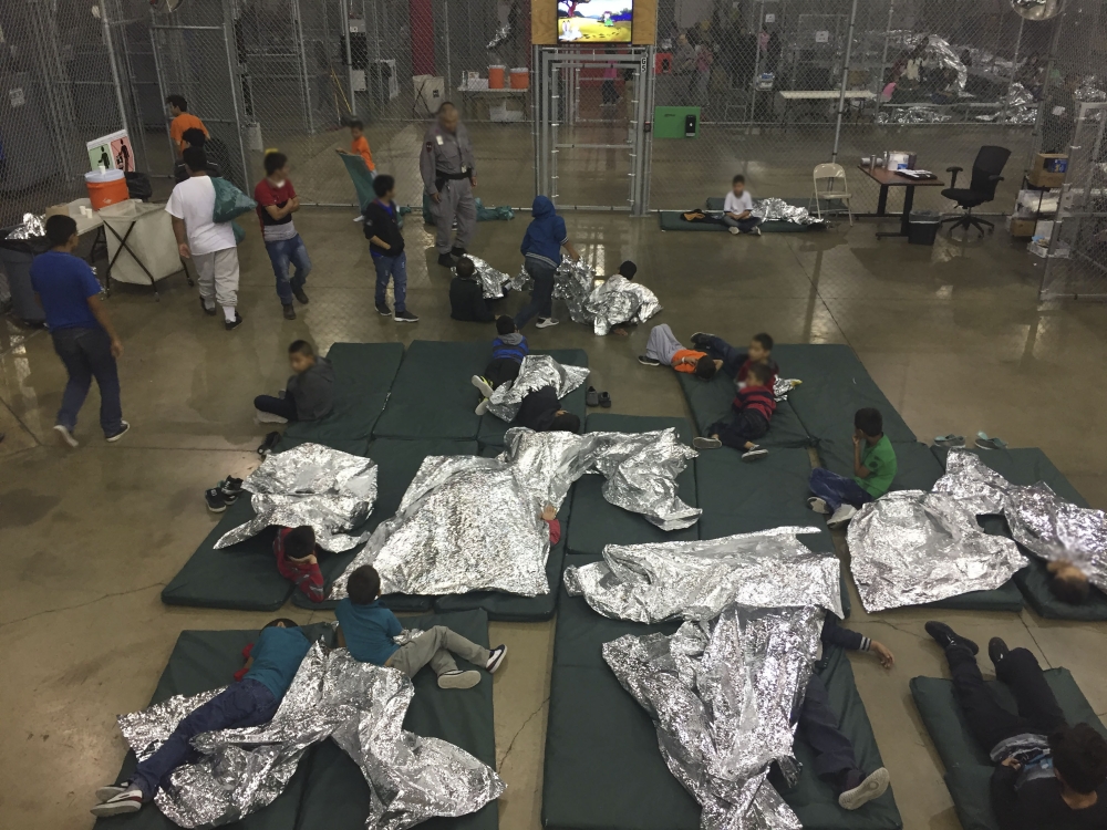 In this file US Customs and Border Protection photo dated June 17, 2018 and obtained June 18, 2018 shows intake of illegal border crossers by US Border Patrol agents at the Central Processing Center in McAllen, Texas. AFP PHOTO / US CUSTOMS AND BORDER PRO