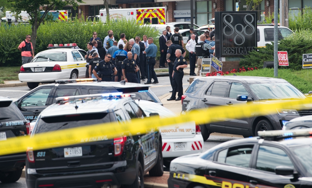 Police respond to a shooting at the offices of the Capital Gazette, a daily newspaper, in Annapolis, Maryland, June 28, 2018. The local ABC7 news reported 