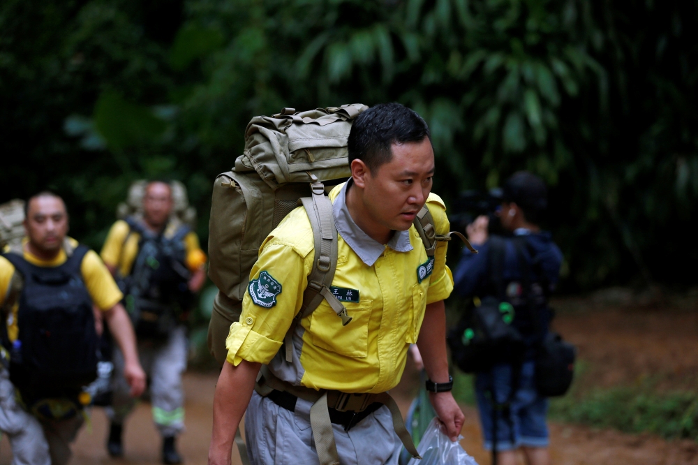 Chinese rescue team arrive, near the Tham Luang cave complex, as an ongoing search for members of an under-16 soccer team and their coach continues, in the northern province of Chiang Rai, Thailand, June 30, 2018. REUTERS/Soe Zeya Tun