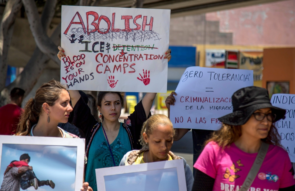 People take part a in protest against US immigration policies in Tijuana, Mexico, on June 30, 2018. The separation of more than 2,000 children from their parents and guardians at the US-Mexico border has sparked international outrage and growing calls in 