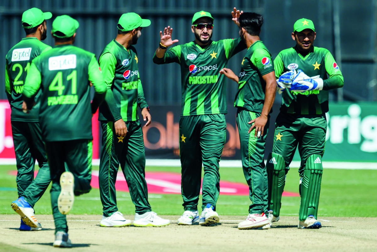 Pakistan players celebrate a wicket in action during the first T20 cricket match between Pakistan and hosts Zimbabwe as part of a tri-series including Australia at Harare Sports Club, on July 1, 2018. AFP / Jekesai Njikizana