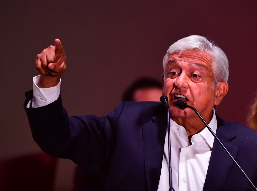 Newly elected Mexico's President Andres Manuel Lopez Obrador (C), running for 