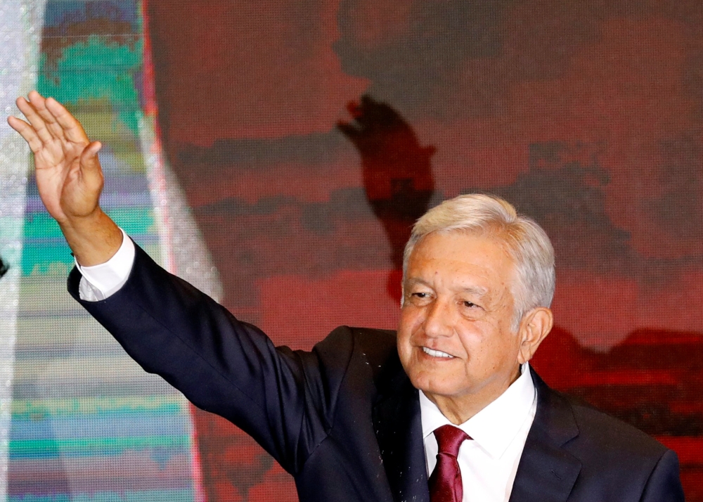 Mexico's next President Andres Manuel Lopez Obrador gestures to supporters in Mexico City, Mexico July 1, 2018. Picture taken July 1, 2018. Reuters/Carlos Jasso