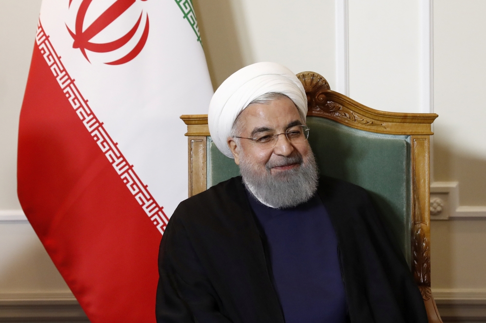 Iranian President Hassan Rouhani is seen at the beginning of a meeting during his official visit to Switzerland in Bern, Switzerland July 2, 2018. Peter Klaunzer/Pool via Reuters