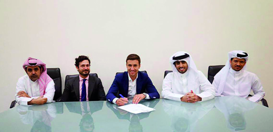 Former Atletico Madrid midfielder Gabriel Fernandez signs a two-deal with Qatar’s Al Sadd in the presence of club officials in Doha yesterday.