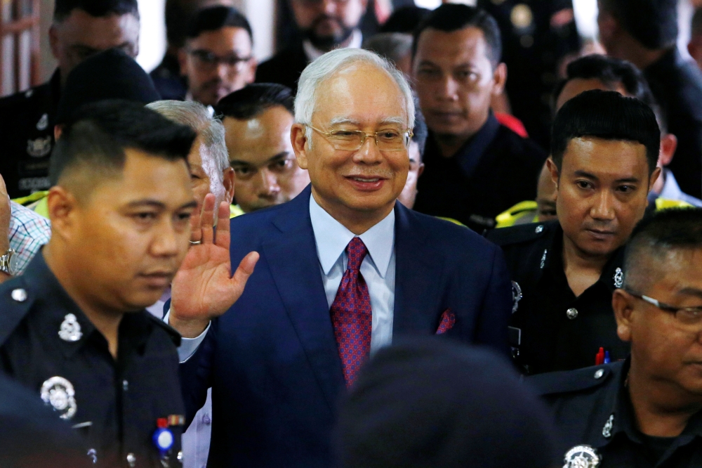 Malaysia's former Prime Minister Najib Razak leaves a courtroom in Kuala Lumpur, Malaysia, July 4, 2018. REUTERS/Lai Seng Sin