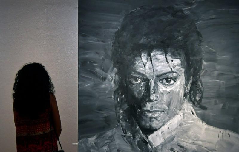 A visitor views 'In Memory of Michael Jackson 1958-2009' by Yan Pei-Ming which forms part of the exhibition 'Michael Jackson: On The Wall' showing until October 21 at the National Portrait Gallery in London, Britain, June 28, 2018. REUTERS/Toby Melville