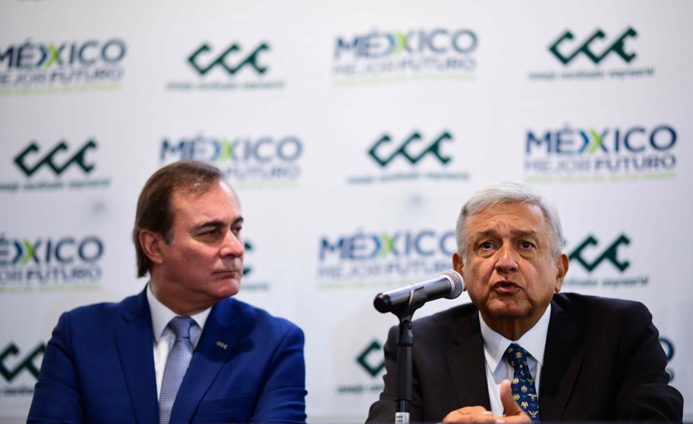 The president of the Businessmen's Coordinating Council, Juan Pablo Castanon (L) listens to Mexico's elected President Andres Manuel Lopez Obrador during a press conference after holding a private meeting in Mexico City, on July 4, 2018. / AFP / Ronaldo S
