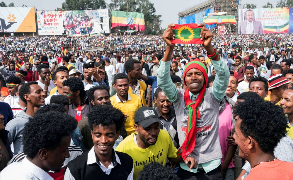 FILE PHOTO: Ethiopians carry their national flag during a rally in support of the new Prime Minister Abiy Ahmed in Addis Ababa, Ethiopia June 23, 2018. REUTERS/Maheder Haileselassie/File Photo