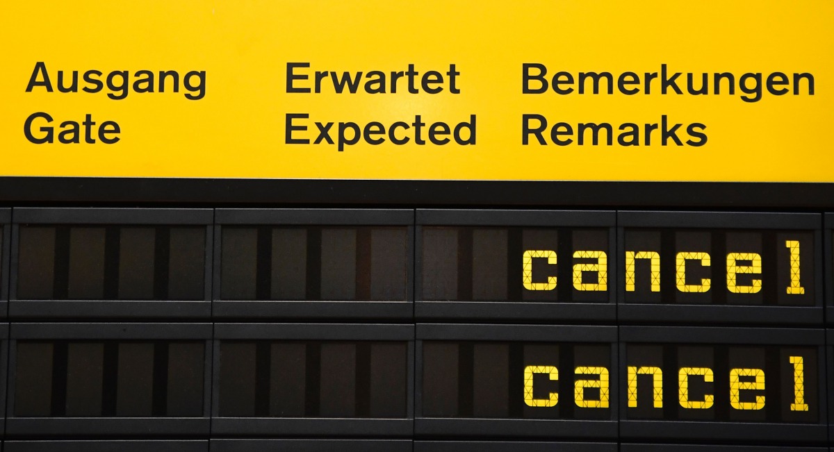 This October 27 2016 photo shows an information board showing cancelled flights due to a one-day strike of German flight operator Eurowings at the Berlin Tegel airport, AFP / Tobias Schwarz