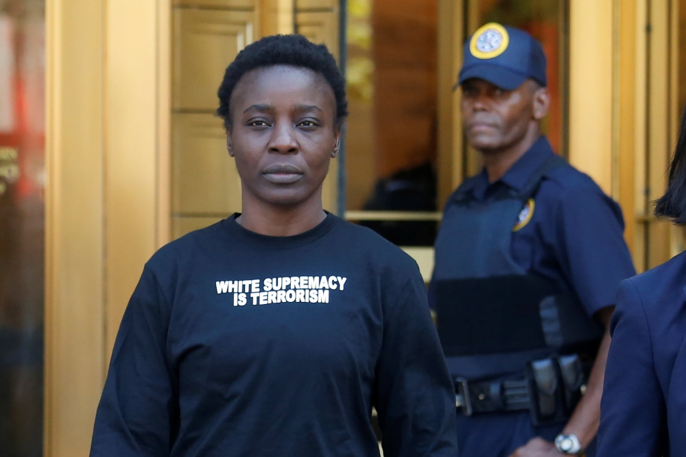 Outside court, the naturalized U.S. citizen from Congo said she climbed the landmark as a spur-of-the-moment protest over the Trump administration's zero-tolerance immigration policies that resulted in the separation of immigrant children from parents acc
