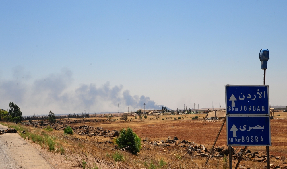 Smoke is seen over Deraa area, Syria July 5, 2018. Picture taken July 5, 2018. Sana/ Handout via Reuters