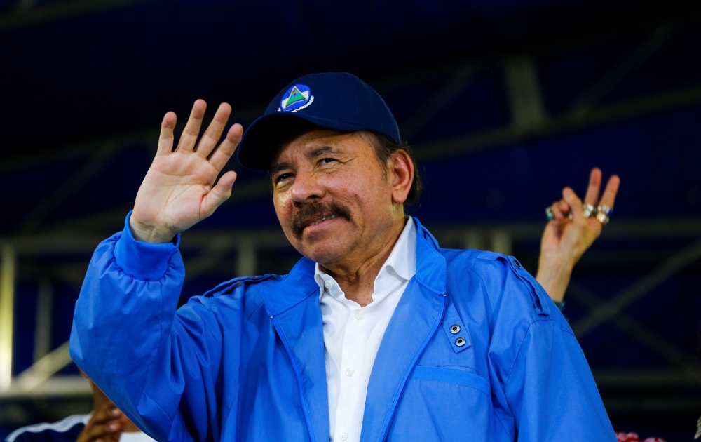Nicaragua's President Daniel Ortega waves to supporters during celebrations to mark the 39th anniversary of the 