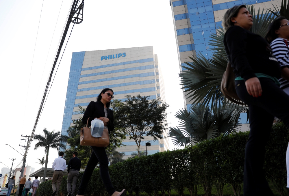 People walk past the Philips headquarters in Barueri, on the outskirts of Sao Paulo, Brazil July 4, 2018. (REUTERS/Nacho Doce)