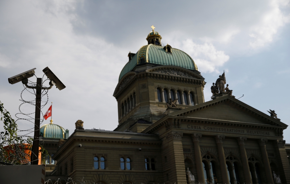 A surveillance camera (CCTV) of the Swiss National Bank (SNB) is pictured in front of the Swiss Federal Palace (Bundeshaus) in Bern, Switzerland, July 2, 2018. Reuters/Denis Balibouse

