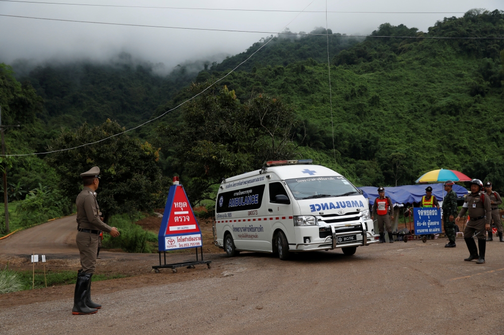 An ambulance is seen Tham Luang cave complex, where scoolboys are trapped in a flooded cave, in the northern province of Chiang Rai, Thailand, July 9, 2018. REUTERS/Soe Zeya Tun