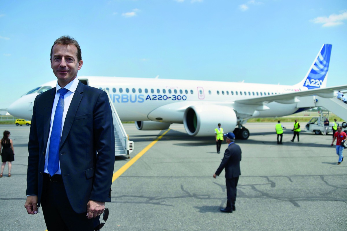 Guillaume Faury, President of the Airbus Commercial Aircraft poses in front of the new Airbus A220-300 during its presentation on July 10, 2018 at the Airbus delivery center, in Colomiers, southwestern France.  AFP / Pascal Pavani