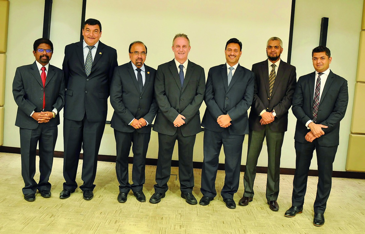 IIA officials with Chris Guest (centre), Head of the Tax and Financial Controls Division, Qatargas and  Girish Jain (third right), Senior Financial Controls Analyst, Qatargas, on the sidelines of the seminar on financial controls.