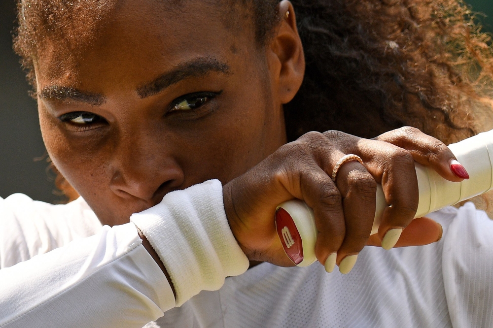 US player Serena Williams reacts against Germany's Julia Goerges during their women's singles semi-final match on the tenth day of the 2018 Wimbledon Championships at The All England Lawn Tennis Club in Wimbledon, southwest London, on July 12, 2018. AFP /