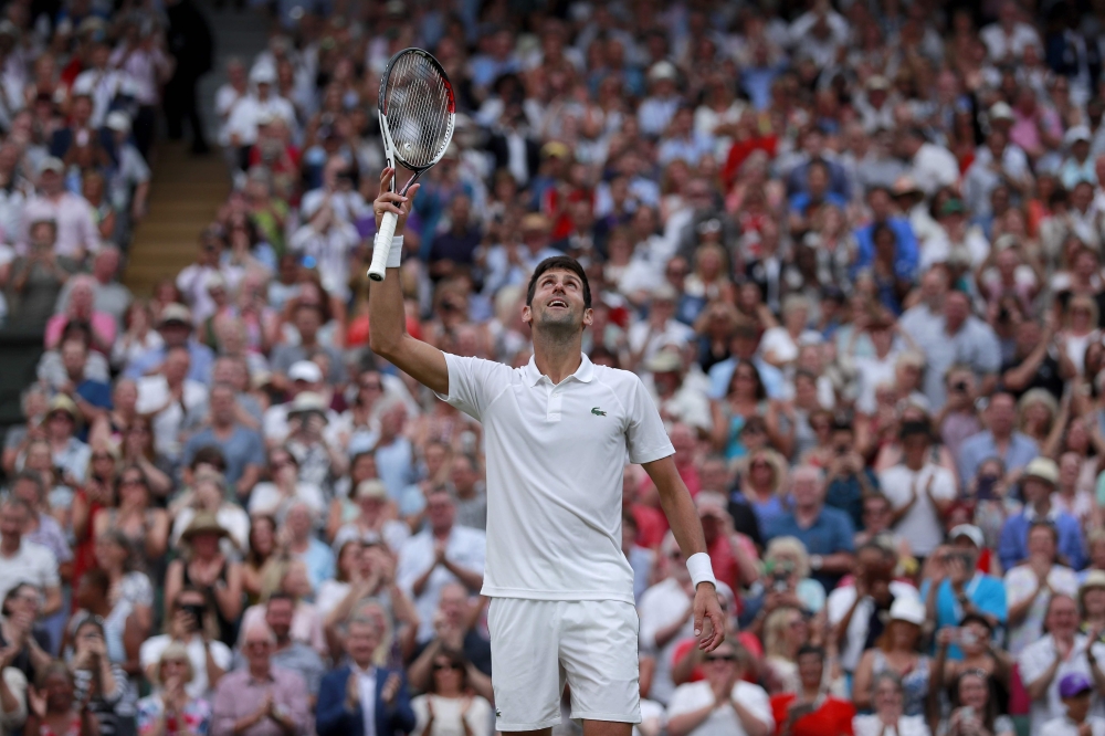 Serbia's Novak Djokovic reacts after beating Spain's Rafael Nadal in their men's singles semi-final match on the twelfth day of the 2018 Wimbledon Championships at The All England Lawn Tennis Club in Wimbledon, southwest London, on July 14, 2018. (AFP / A