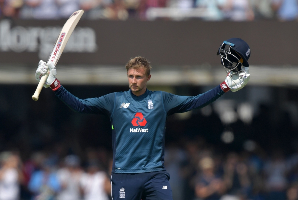 England's Joe Root celebrates scoring his century during the second One Day International (ODI) cricket match between England and India, at Lord's Cricket Ground in London on July 14, 2018. (AFP / OLLY )