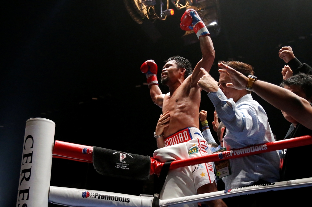 Manny Pacquiao celebrates after winning the bout against Lucas Matthysse REUTERS/Lai Seng Sin