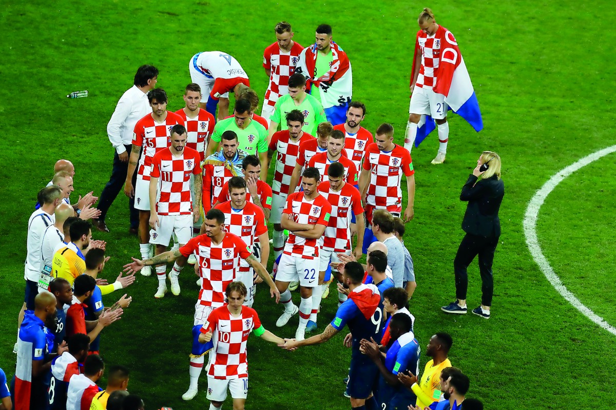 Croatian players shake hands with their French counterparts following the FIFA 2018 World Cup final on Sunday.