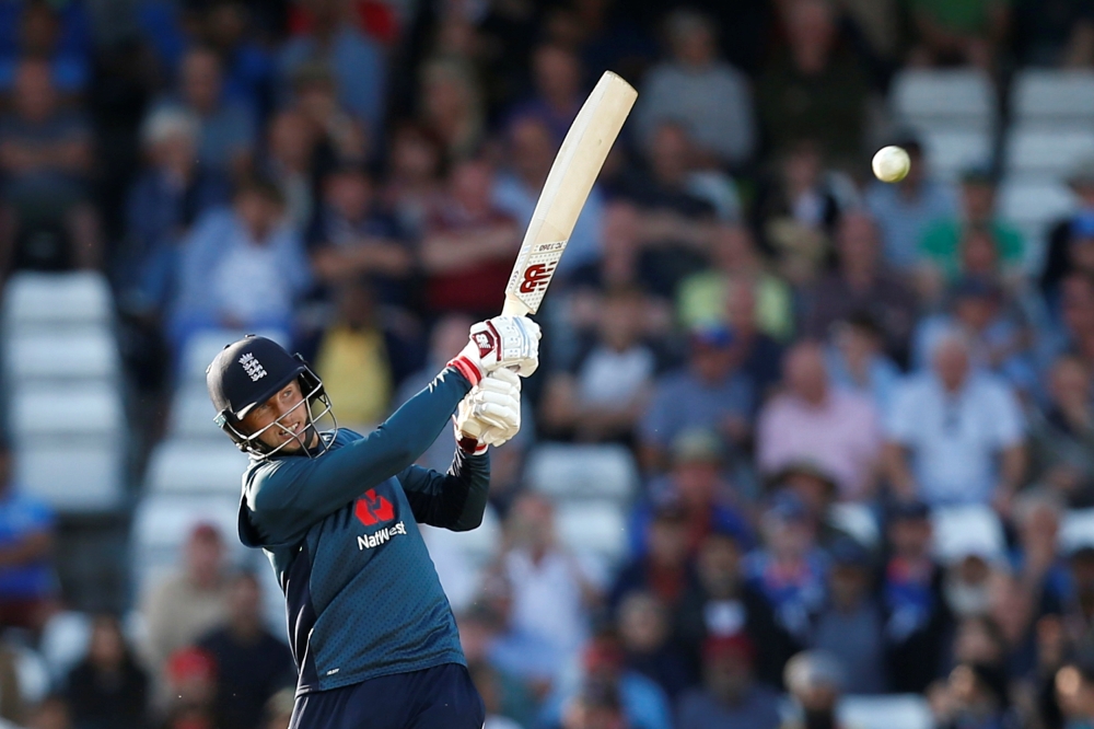 England's Joe Root hits a four for his century and to win the match (Reuters/Ed Sykes)