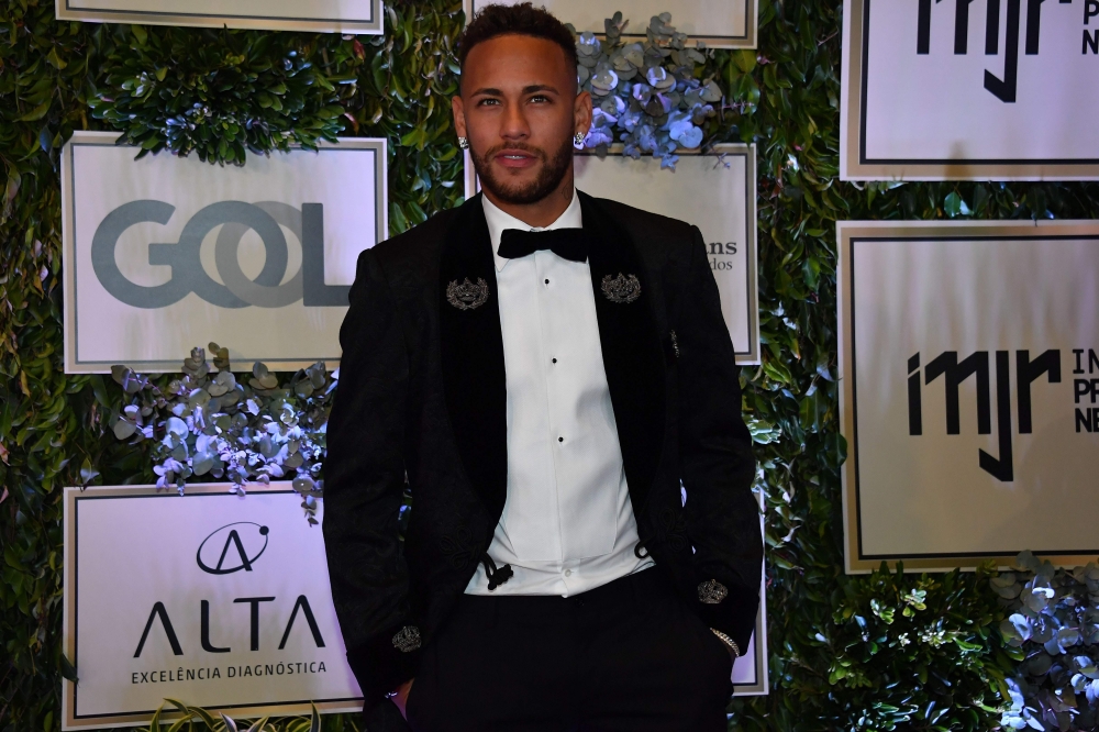 Brazilian PSG's footballer Neymar Junior, arrives to participate in the charity auction of the Neymar Jr. Institute in Sao Paulo, Brazil on July 19, 2018. (AFP / NELSON ALMEIDA)