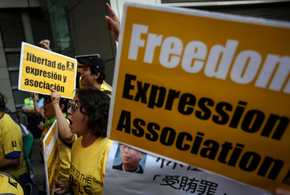 Protesters march during a demonstration against Article 23 and bans on freedom of association in Hong Kong on July 21, 2018. Police in Hong Kong sought to ban a political party which promotes independence for the city on July 17, citing it as a potential 