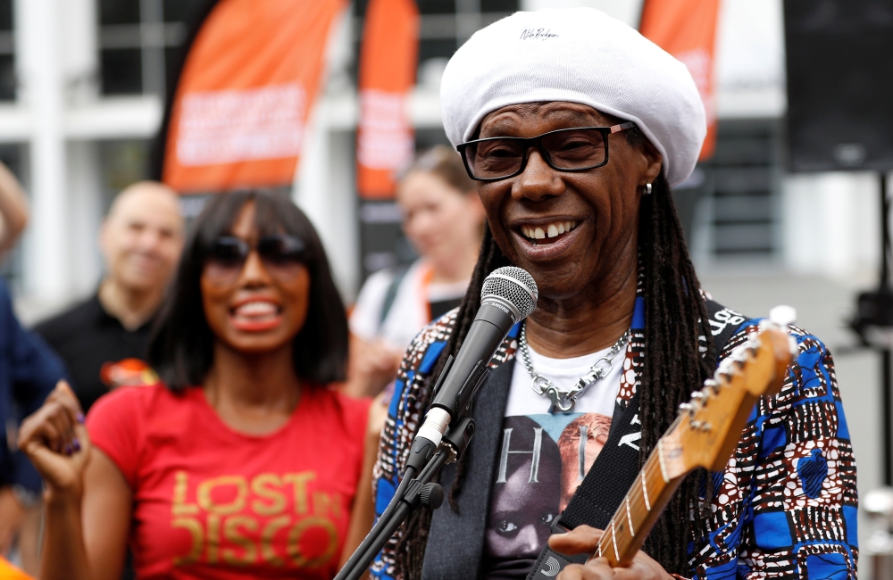 Musician Nile Rodgers poses for photographs as he launches International Busking Day at Wembley Park, in London, Britain, July 21, 2018. Reuters/Peter Nicholls

