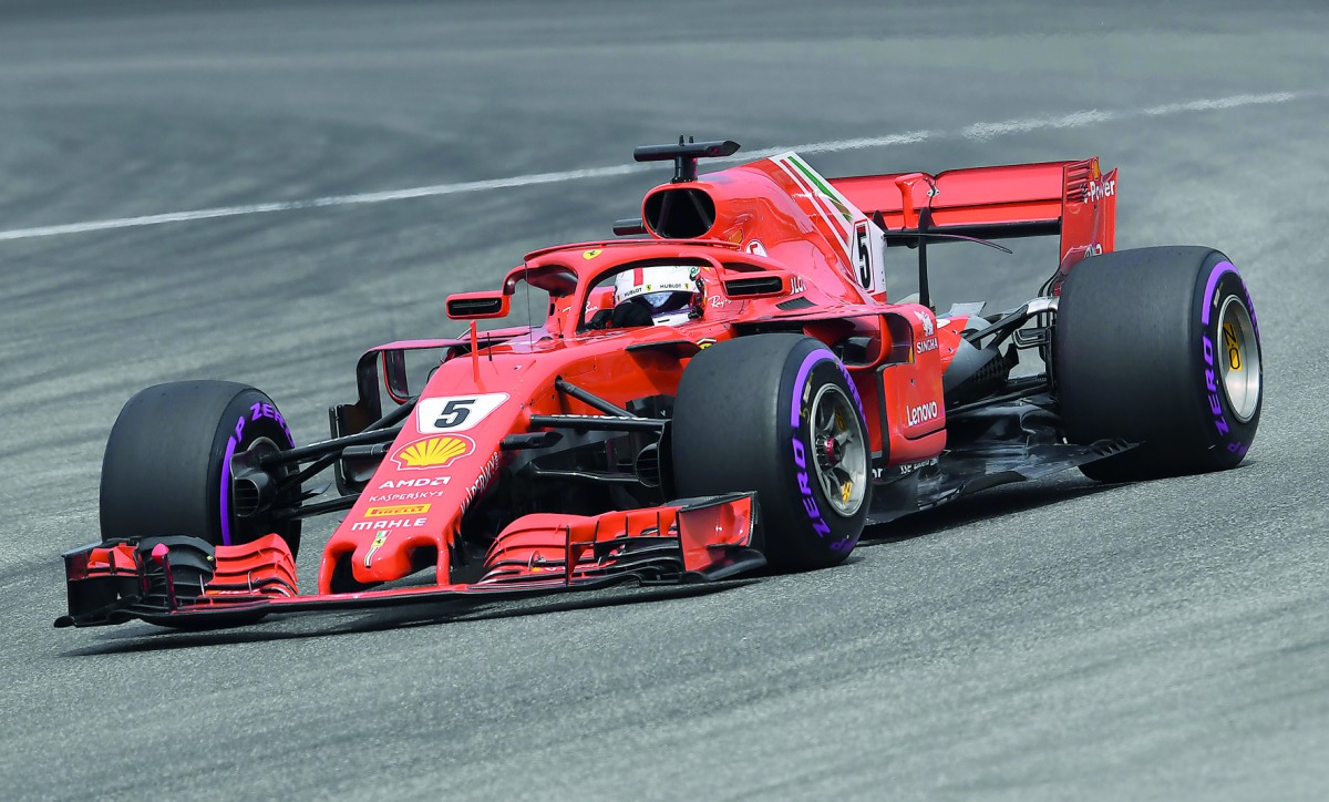 Ferrari's German driver Sebastian Vettel steers his car during the qualifying session on the eve of the German Formula One Grand Prix at the Hockenheimring racing circuit on July 21, 2018 in Hockenheim, southern Germany.  AFP / Christof Stache

