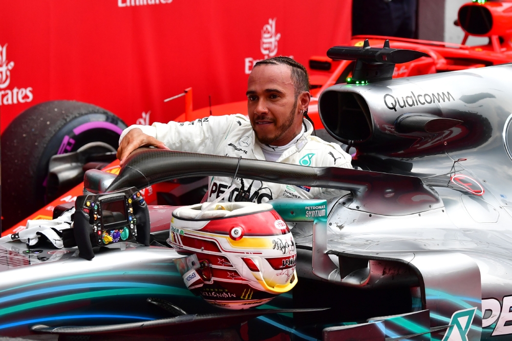 Mercedes' British driver Lewis Hamilton leaves his car after winning the German Formula One Grand Prix at the Hockenheim racing circuit on July 22, 2018 in Hockenheim, southern Germany. / AFP / Andrej ISAKOVIC