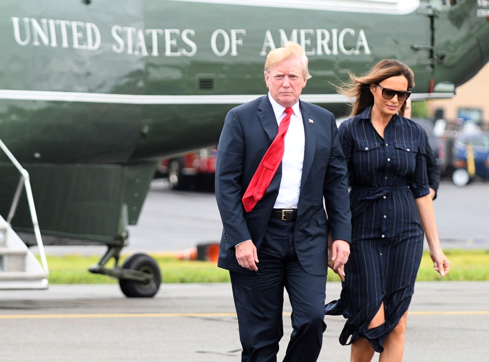 U.S. President Donald Trump and First Lady Melania Trump disembark Marine One upon departure from Morristown in New Jersey, U.S., July 22, 2018. REUTERS/Mary F. Calvert