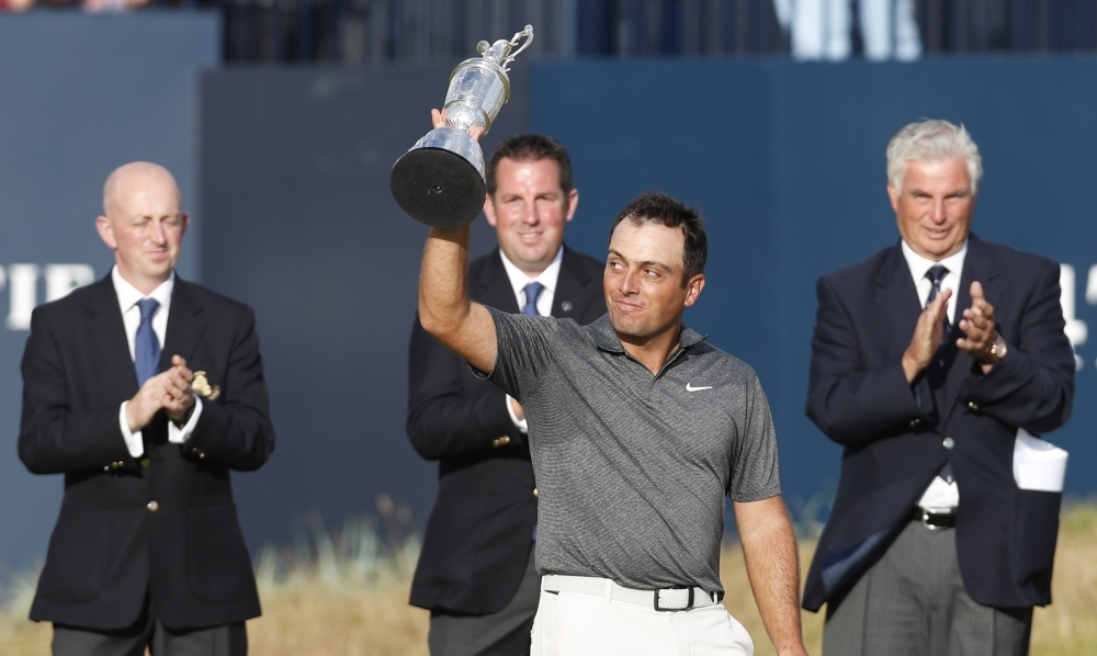 Italy's Francesco Molinari celebrates with the Claret Jug after winning the 147th Open Championship. REUTERS/Paul Childs
