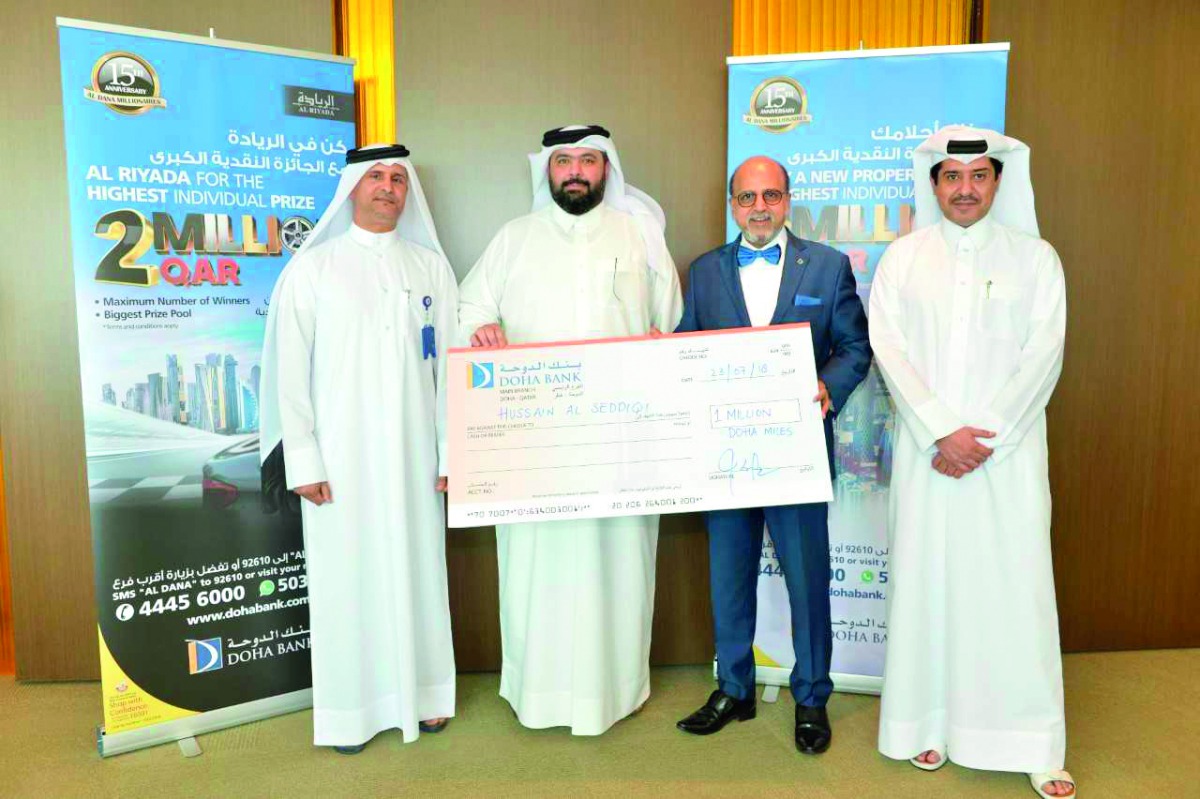 Dr Seetharaman (second right) CEO of Doha Bank with other officials and salary campaign winners. 