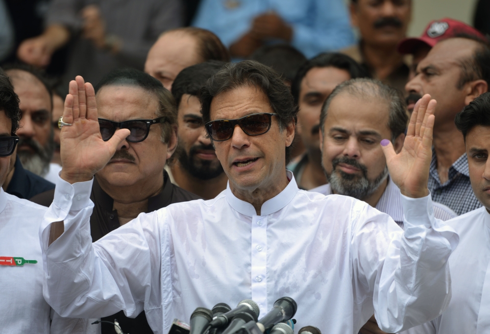 Pakistan's cricketer-turned politician Imran Khan of the Pakistan Tehreek-e-Insaf (Movement for Justice) speaks to the media. (AFP / AAMIR QURESHI)