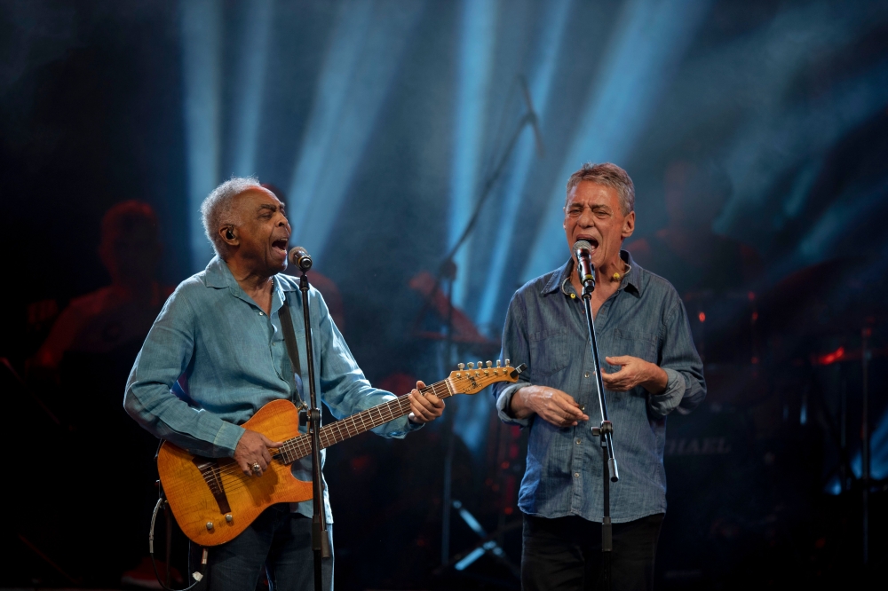 Brazilian musicians Gilberto Gil (L) and Chico Buarque perform during the 