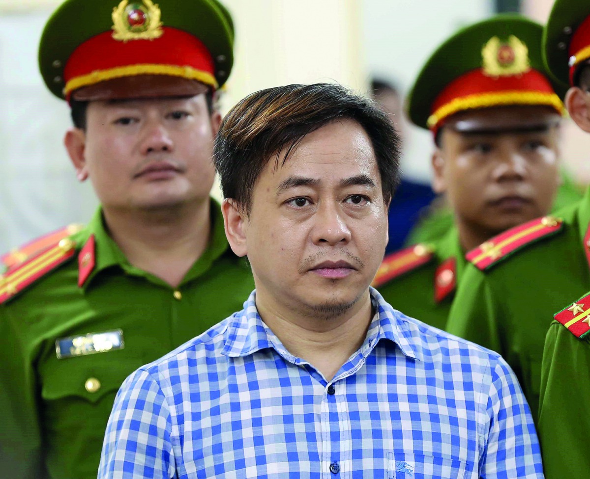 Phan Van Anh Vu (Vu Nhom) listens during the verdict session of his trial at a court in Hanoi, Vietnam July 30, 2018. VNA/Doan Tan via Reuters