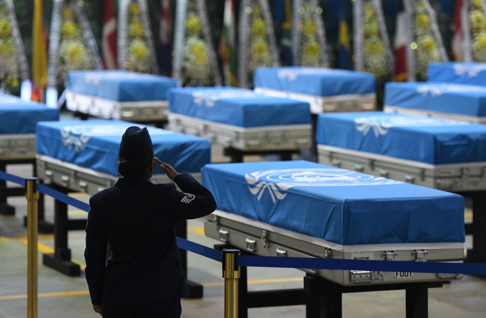 A U.S. airwoman salutes during a repatriation ceremony for remains transferred by North Korea, at Osan Air Base in Pyeongtaek, South Korea August 1, 2018. (Jung Yeon-je/ REUTERS)