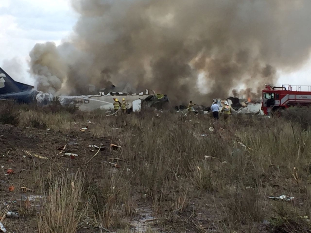 Rescue personnel work at the site where an Aeromexico-operated Embraer passenger jet crashed in Mexico's northern state of Durango, July 31, 2018, in this picture obtained from social media. (Proteccion Civil Durango/via REUTERS )