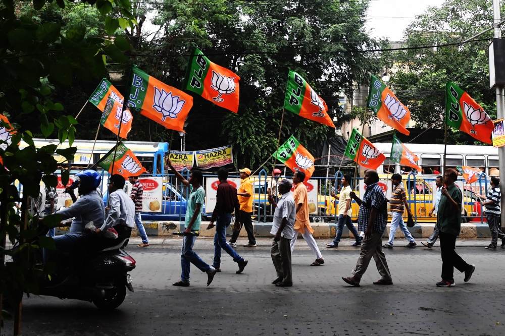 Bhartiya Janata Party (BJP) activists shout slogans in support of the publication of the first complete draft of the National Register of Citizens (NRC) and against what they say is illegal immigration of people from Bangladesh during a rally in Kolkata o