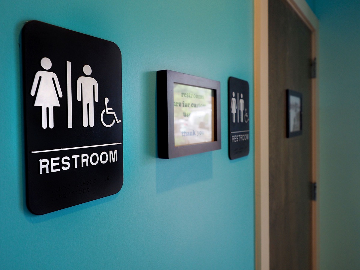 Unisex signs hanging outside bathrooms at Toast Paninoteca in Durham, North Carolina, May 9, 2016.  AFP/Getty Images North America/Sara D Davis